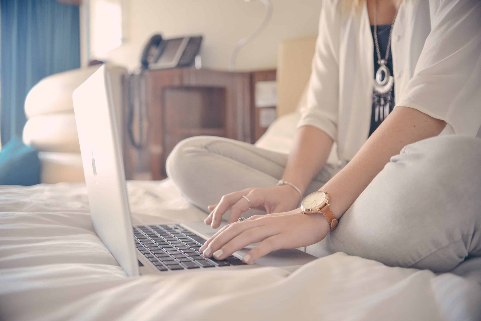 woman typing on a laptop